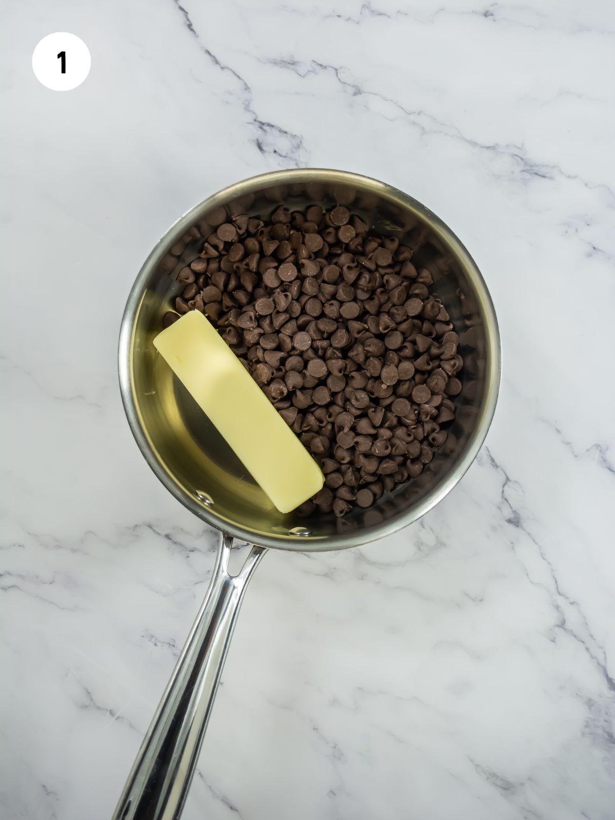 chocolate chips and stick of butter in a saucepan