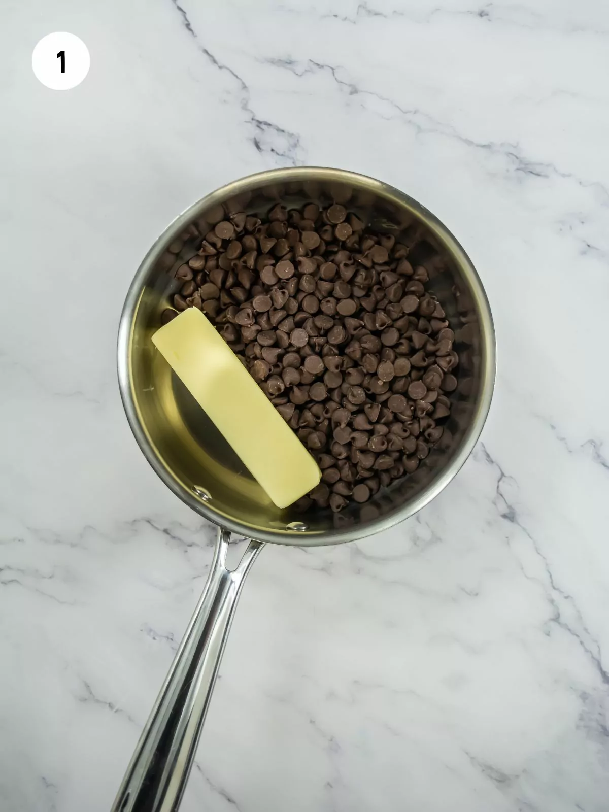 chocolate chips and stick of butter in a saucepan