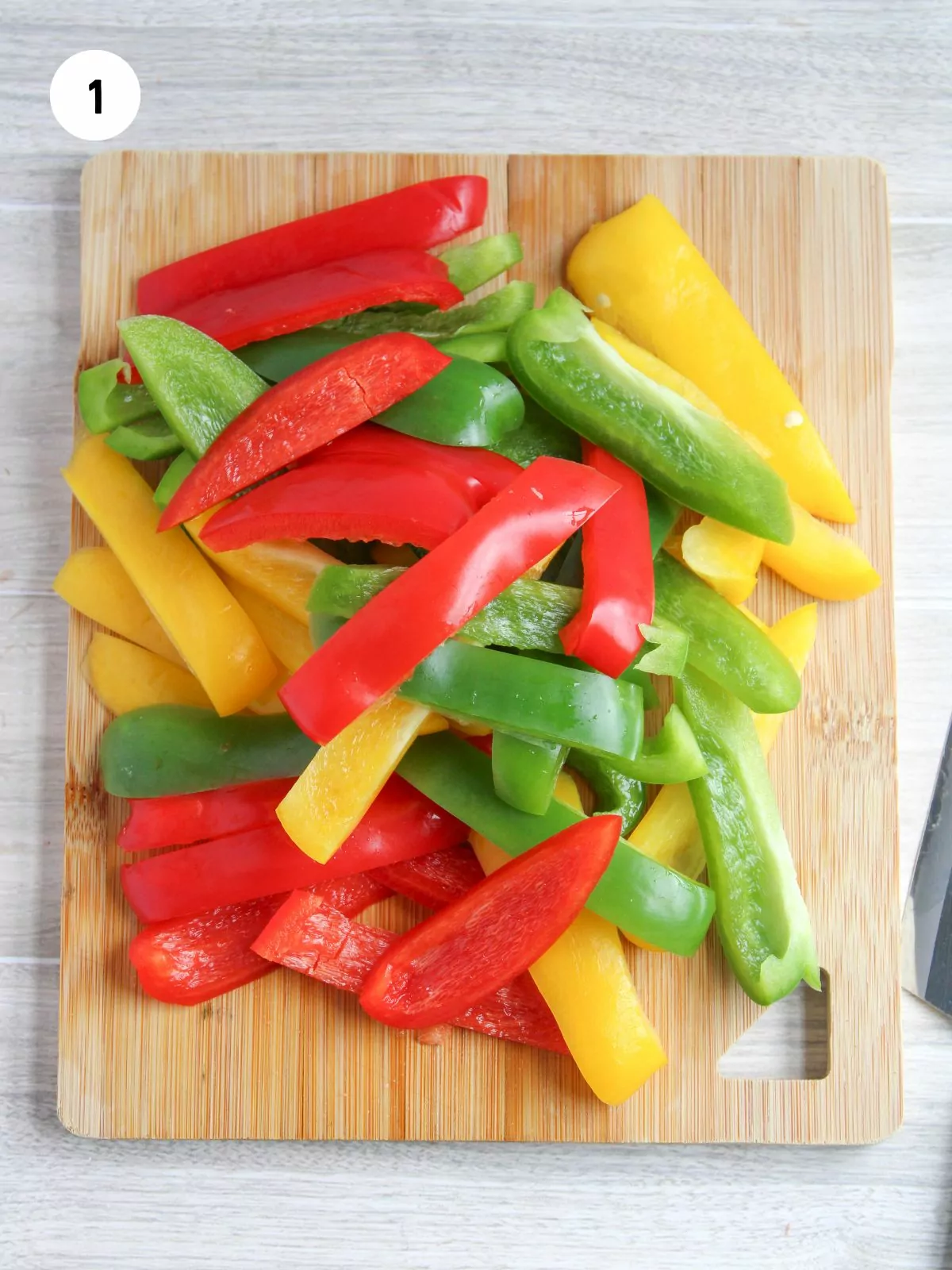 slice bell peppers on a cutting board