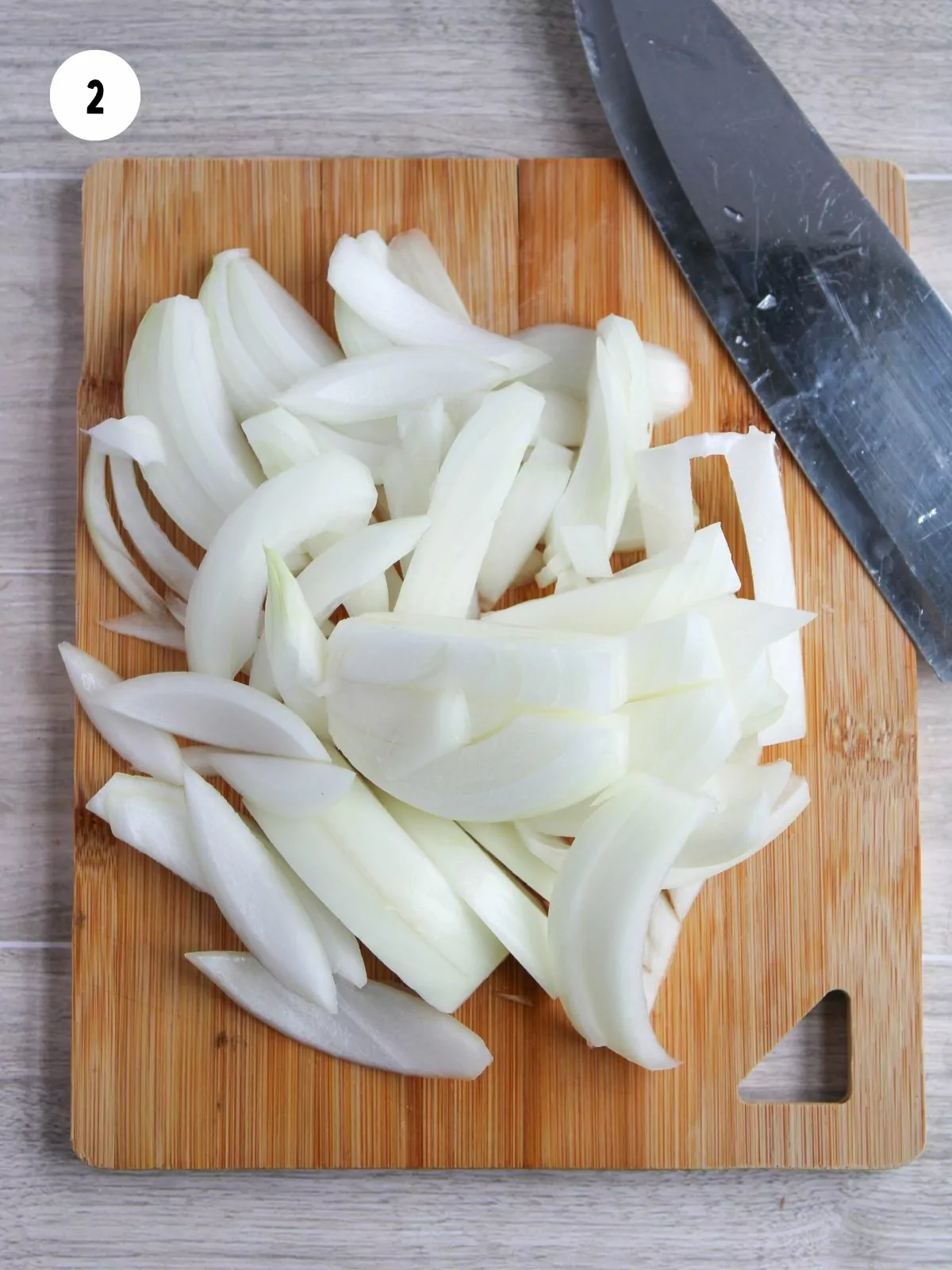 sliced onions on a cutting board