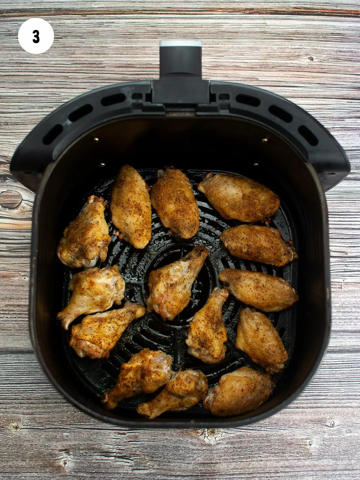 cooked wings in the air fryer basket