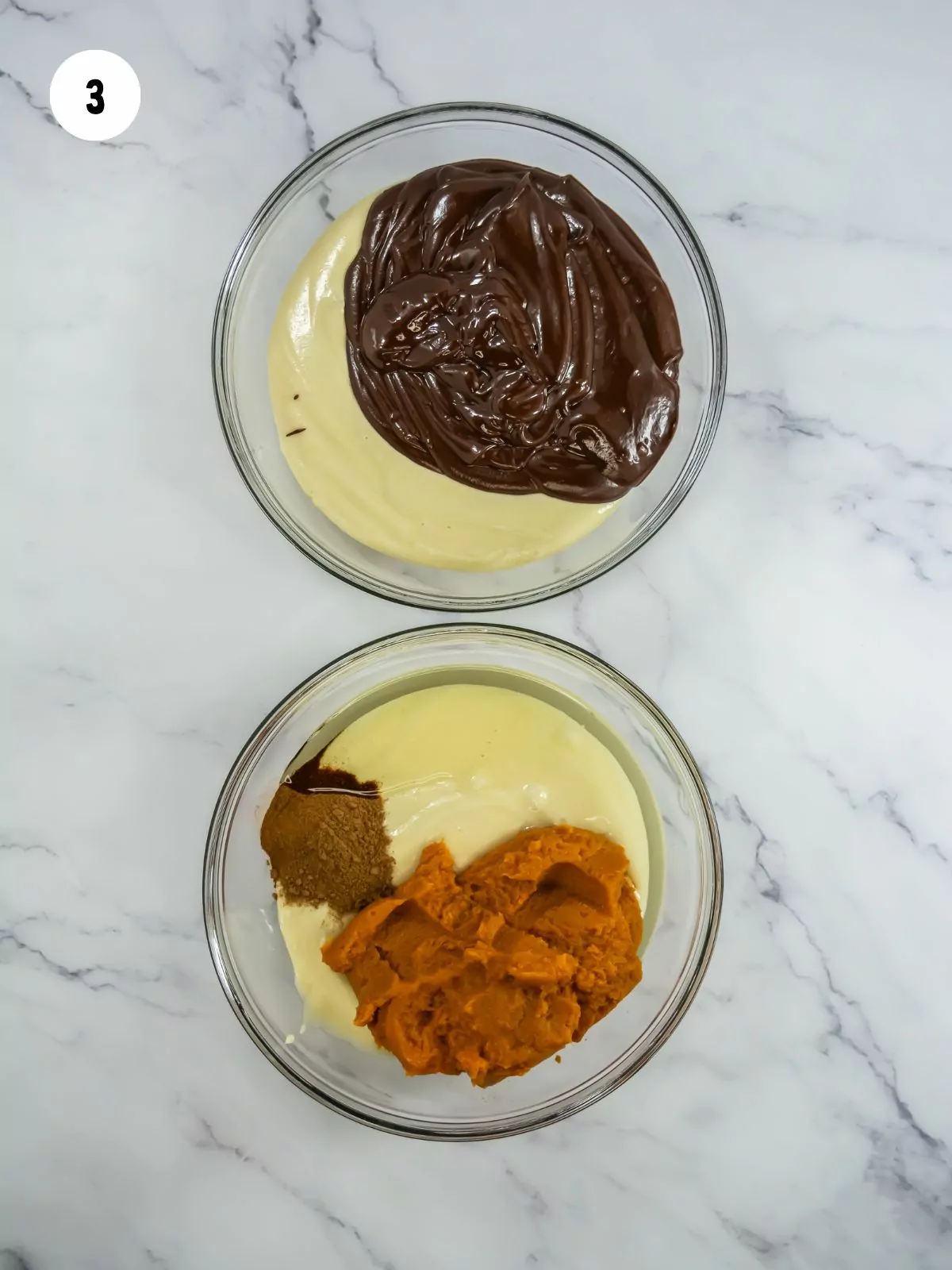 melted chocolate added to batter in the top bowl. The bottom bowl has pumpkin puree, spices, and oil added to another bowl of batter