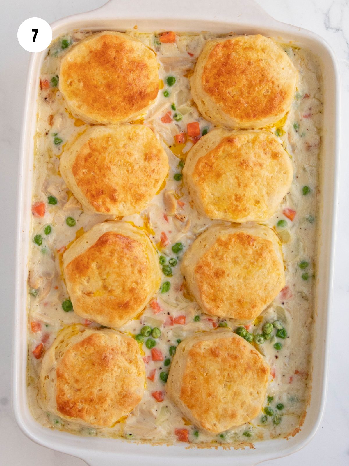 golden brown biscuits on top of pot pie mixture