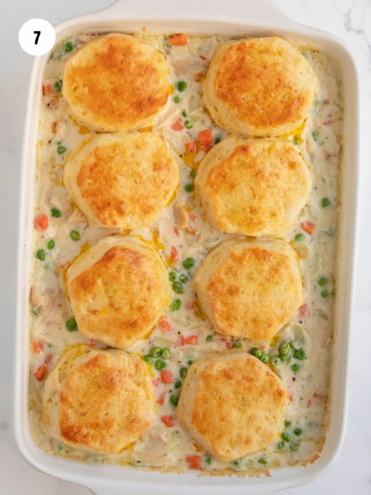 golden brown biscuits on top of pot pie mixture