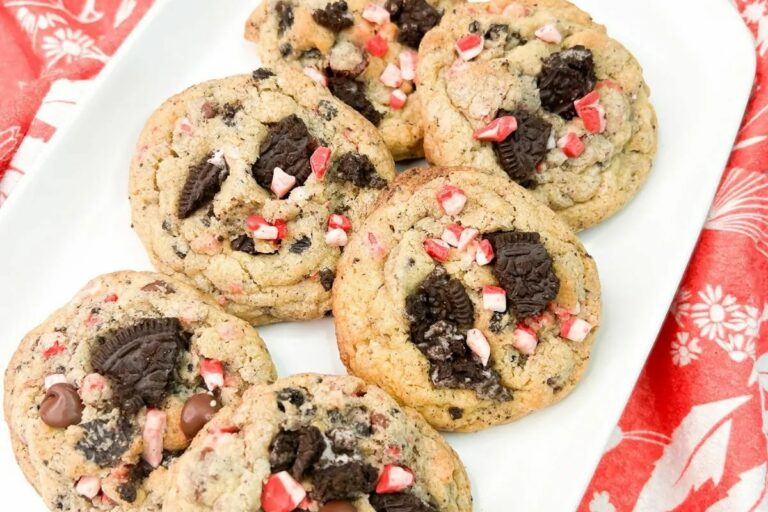 a plate of six cookies with Oreo toppings