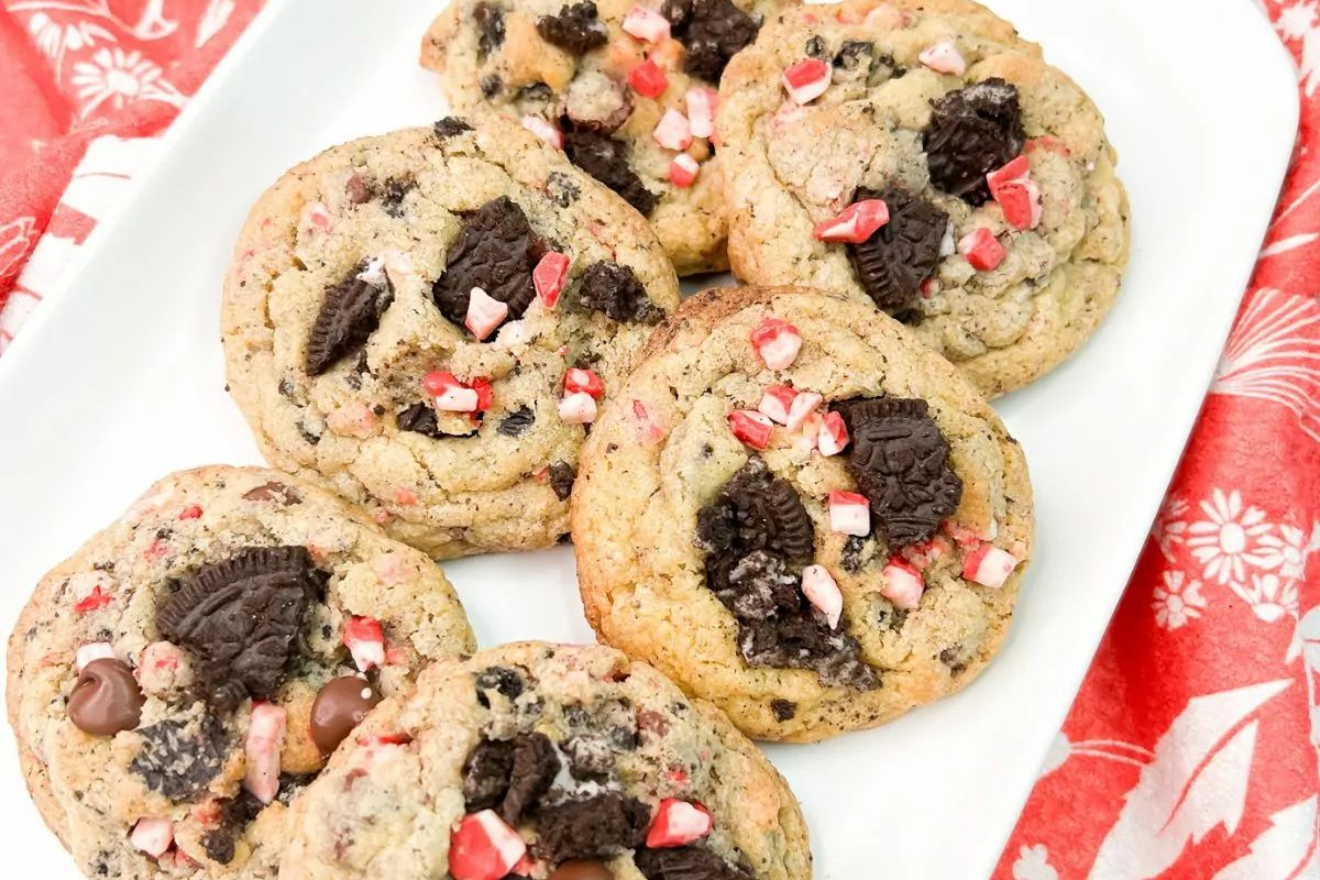 a plate of six cookies with Oreo toppings