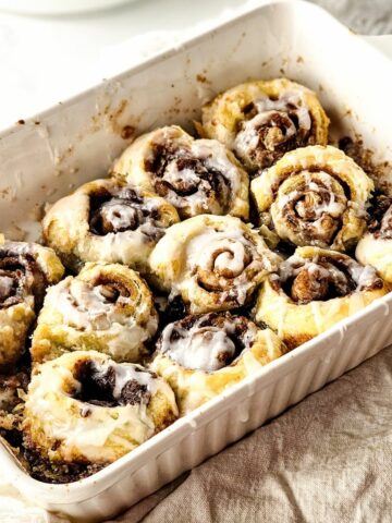 baked Cinnamon Rolls made with Puff Pastry in a white baking dish