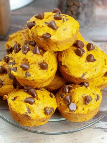 Pumpkin Chocolate Chip Muffins with Cake Mix piled on a plate