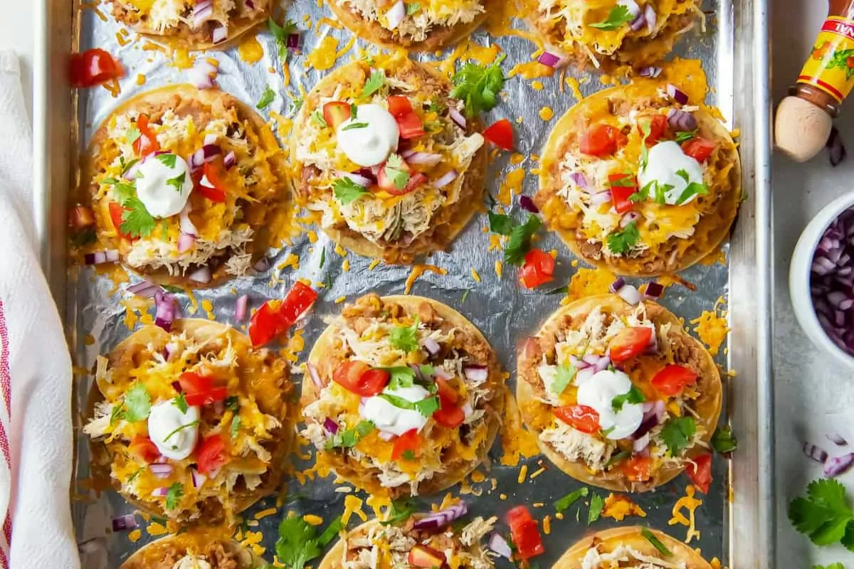 mini chicken tostadas on a sheet pan