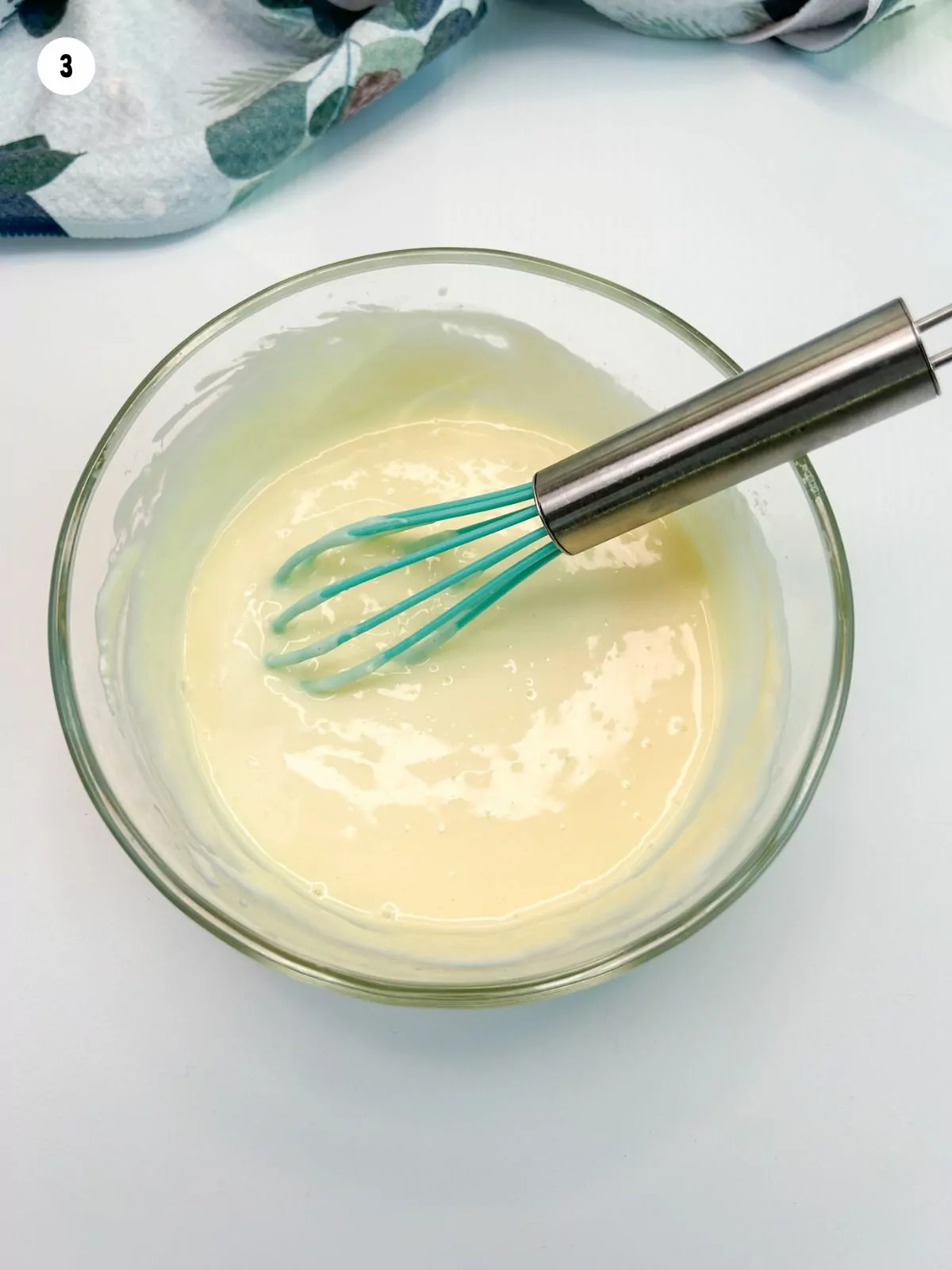 cream cheese mixture in bowl with whisk.