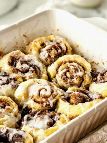 baked cinnamon rolls in casserole dish.