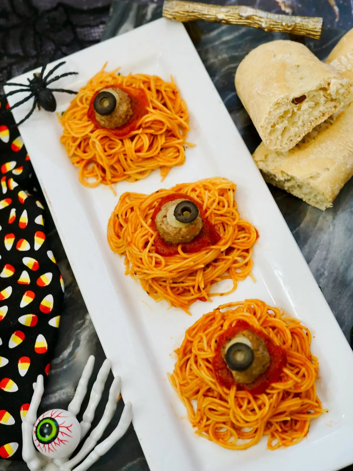 plate of spaghetti with meatballs made to look like spooky eyes for Halloween.