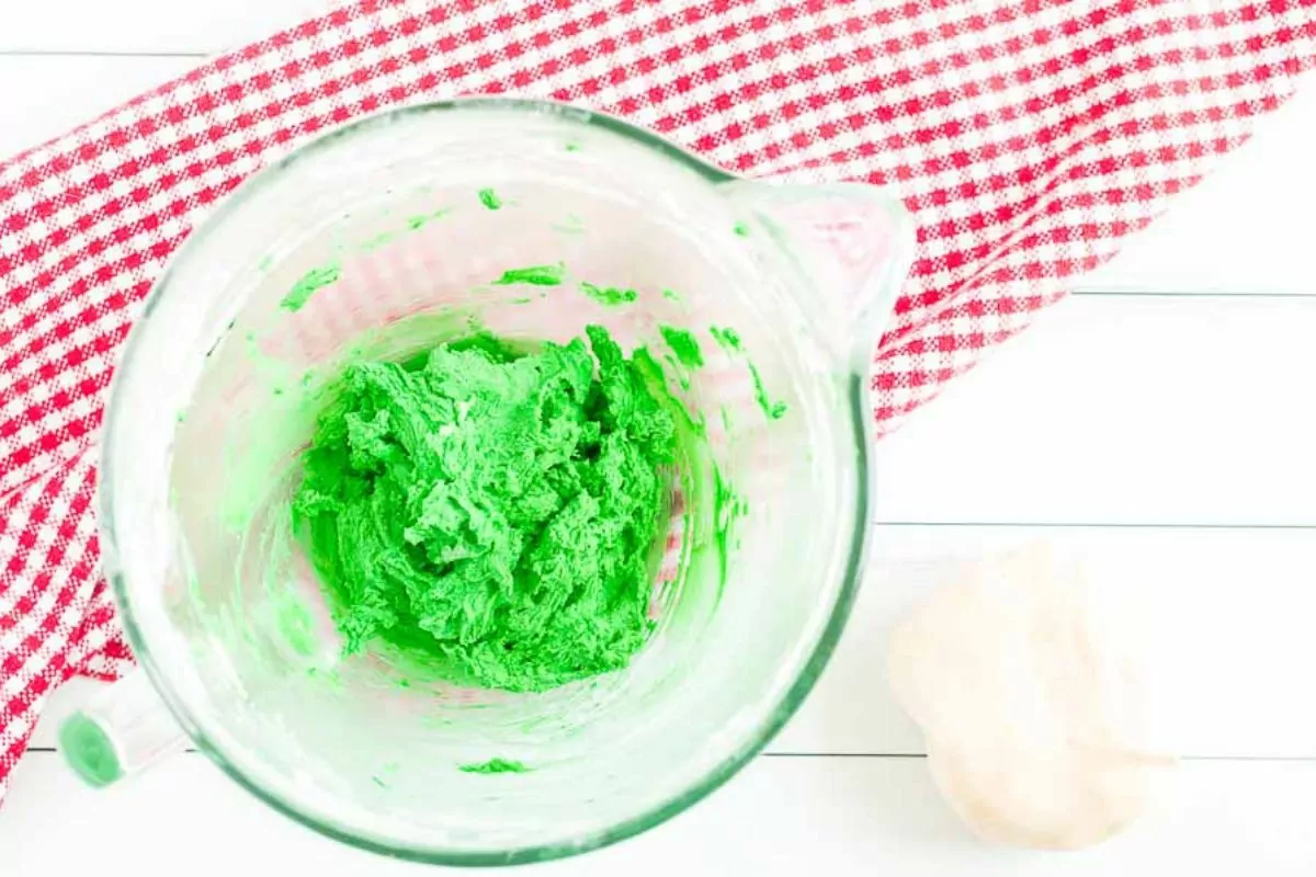 green cookie dough in mixing bowl.