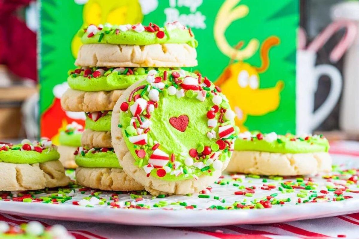 crumbl sugar cookies with green icing and Christmas sprinkles