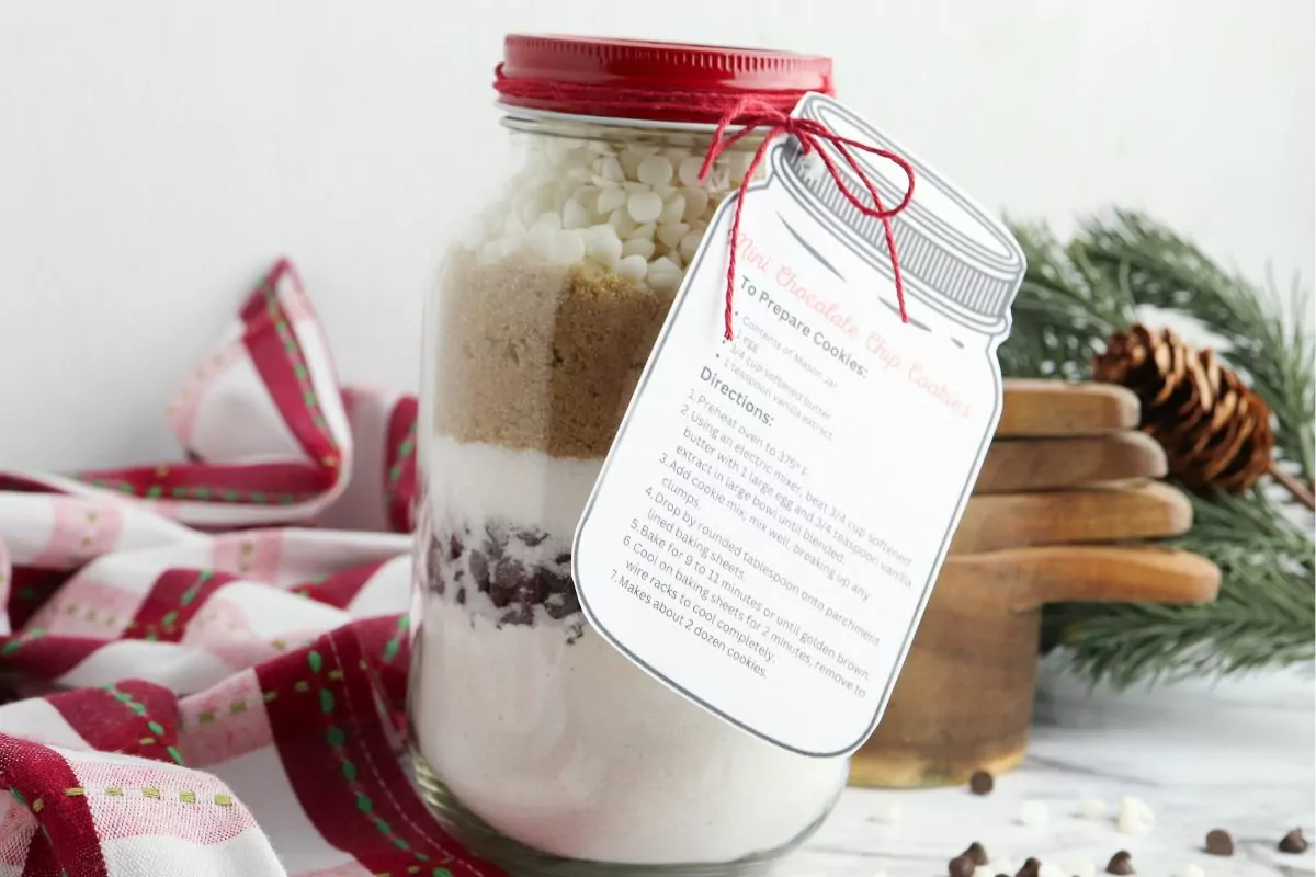 mason jar with cookie mix and a printed gift tag.