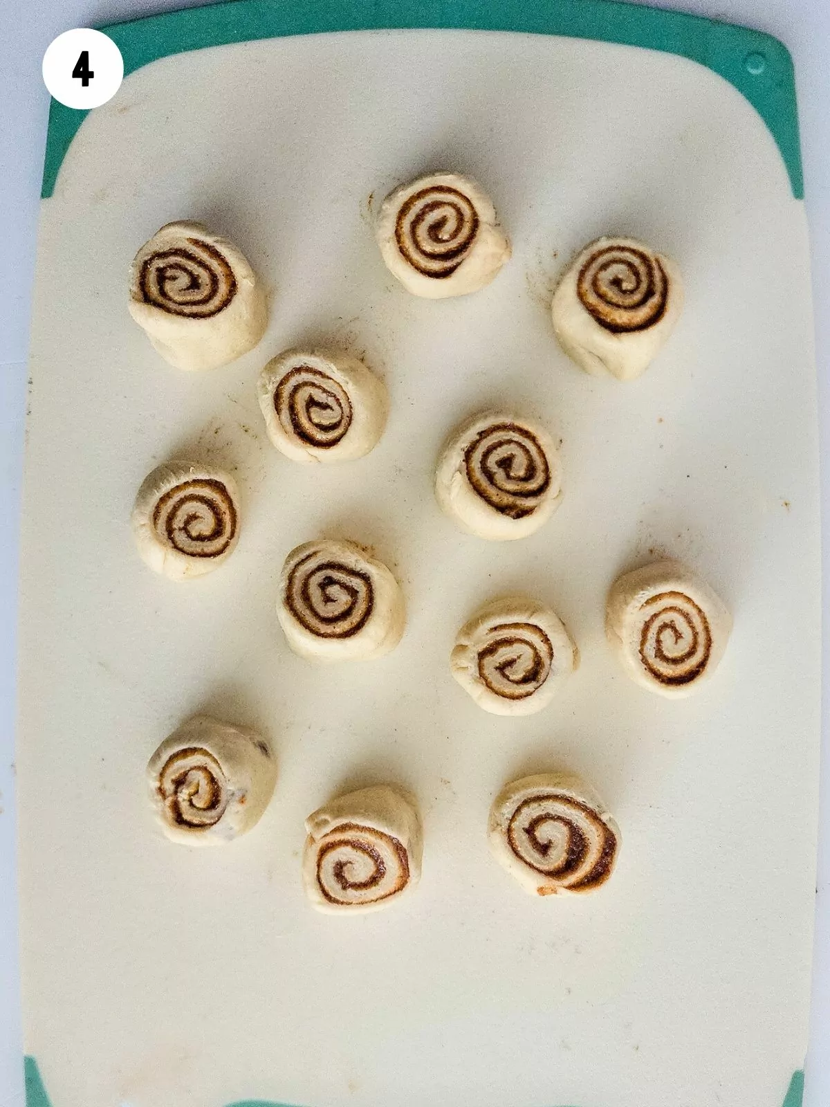 cinnamon rolls sliced on cutting board.