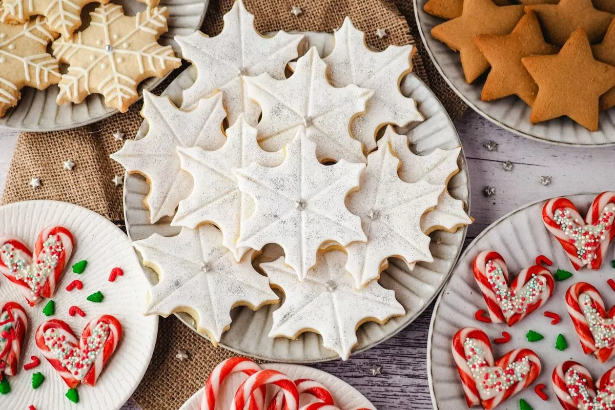 a plate of snowflake cookies