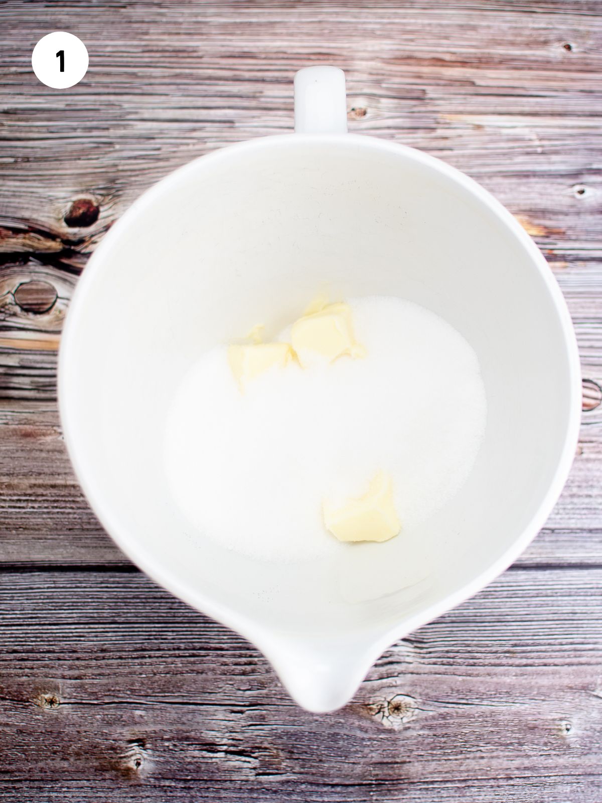 butter and sugar in white mixing bowl