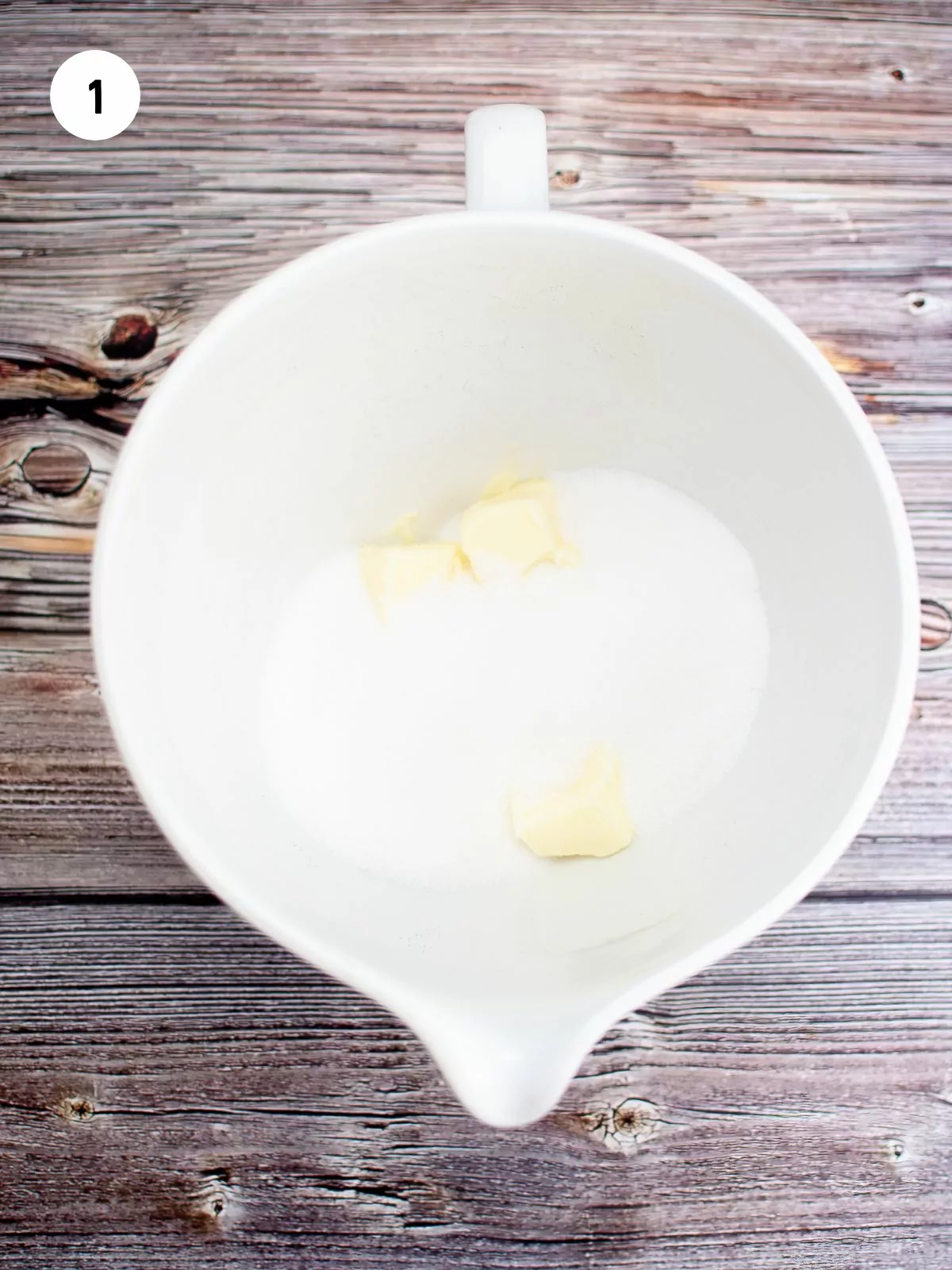 butter and sugar in white mixing bowl