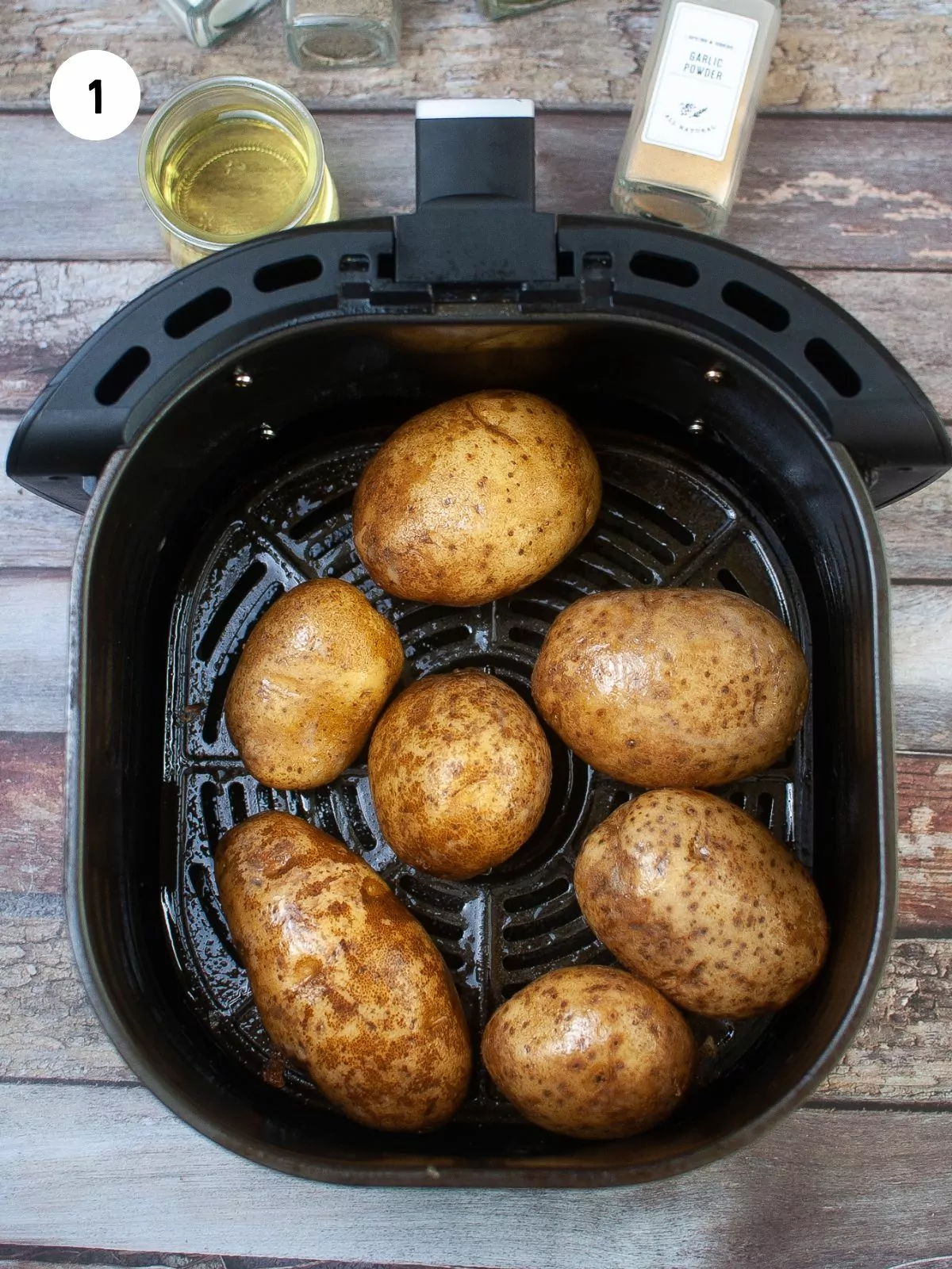 potatoes coated in oil in the air fryer basket