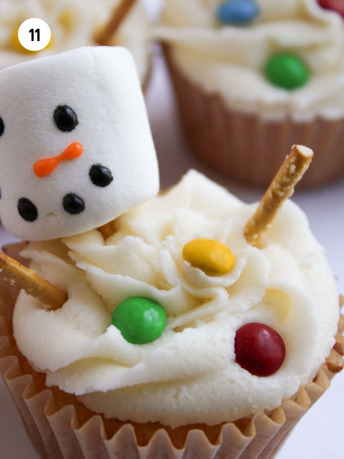 mini m&m's added to the frosting for the snowman's buttons