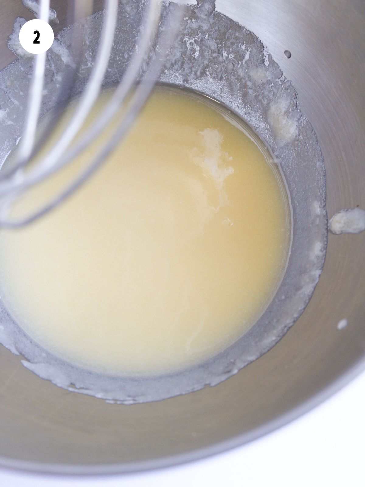 melted butter in a stainless steel mixing bowl