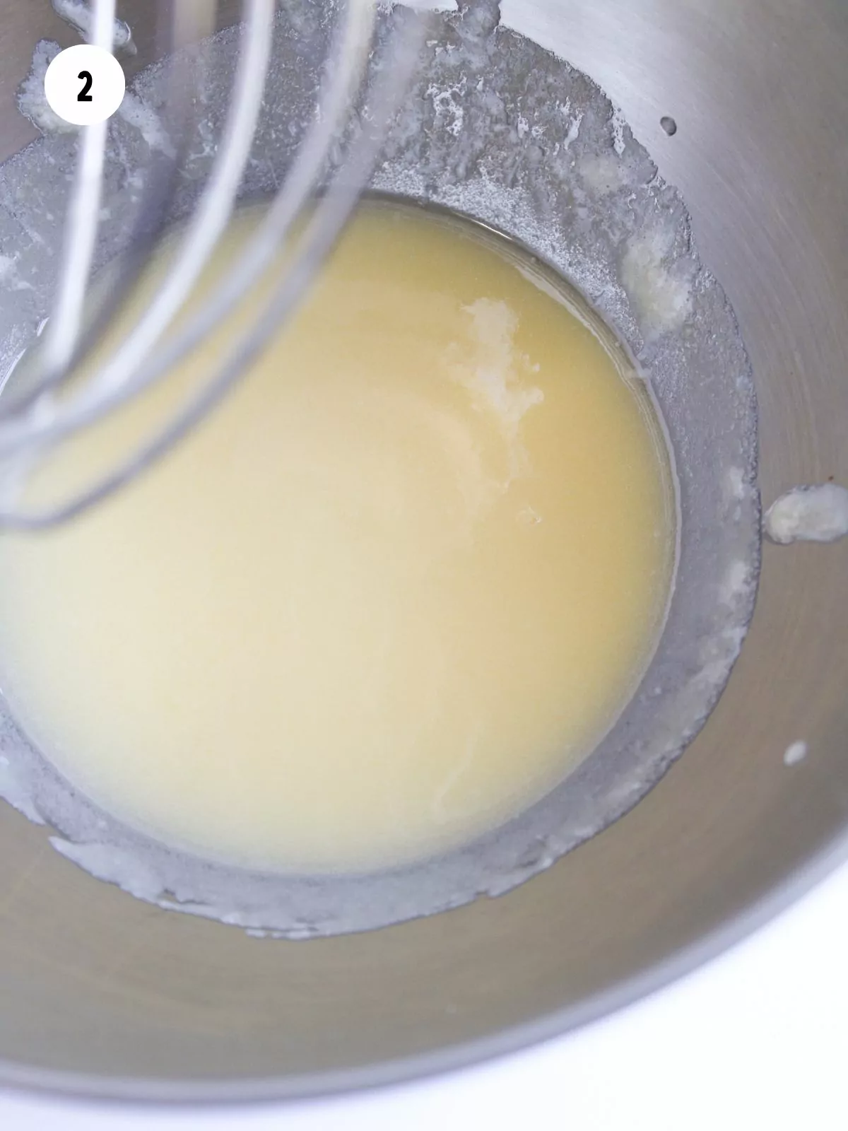 melted butter in a stainless steel mixing bowl