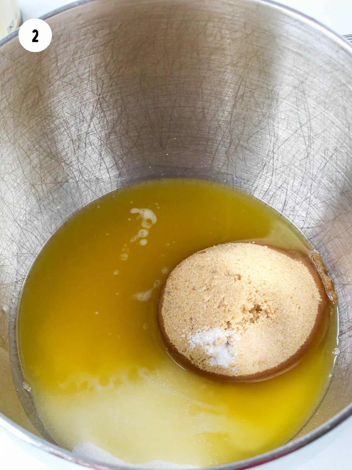 melted butter, sugar, and brown sugar in a stainless steel mixing bowl