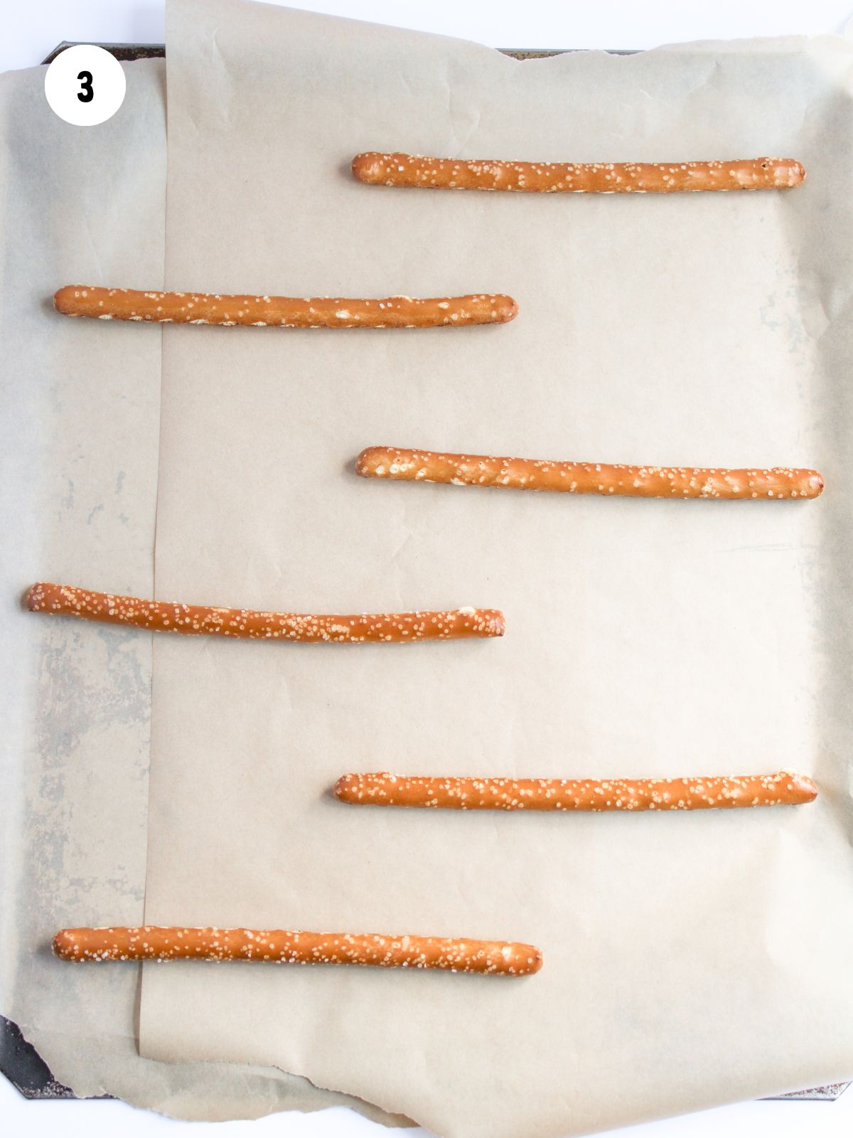 Pretzel rods on parchment paper