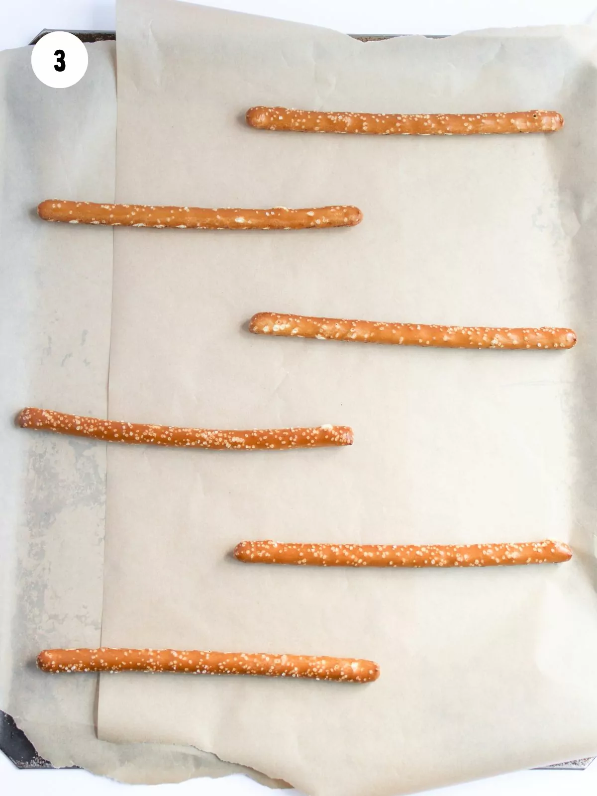 Pretzel rods on parchment paper