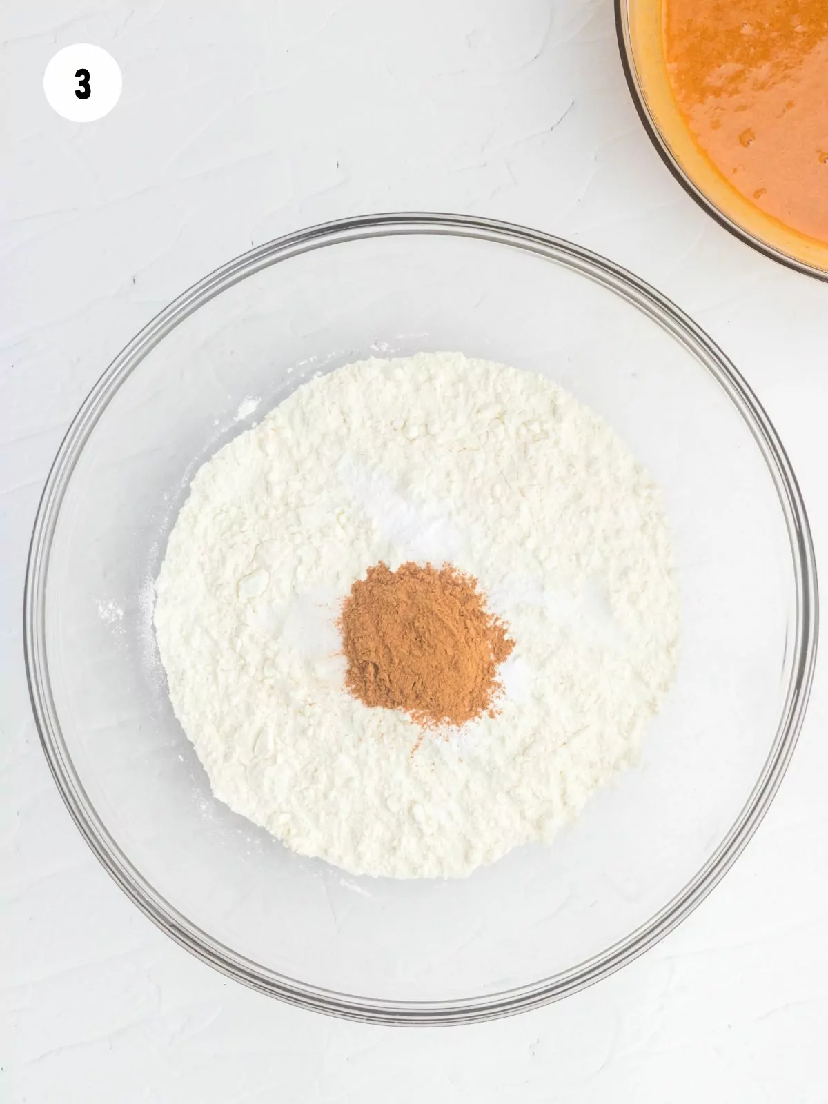 flour, cinnamon, salt, and baking soda in a clear mixing bowl