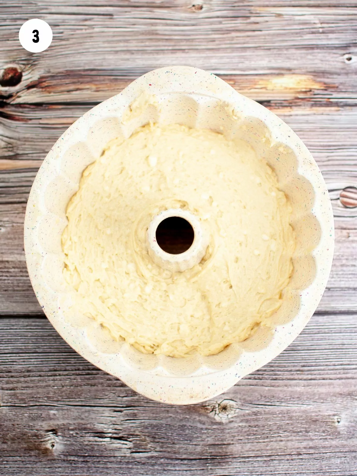 half the batter in a bundt pan