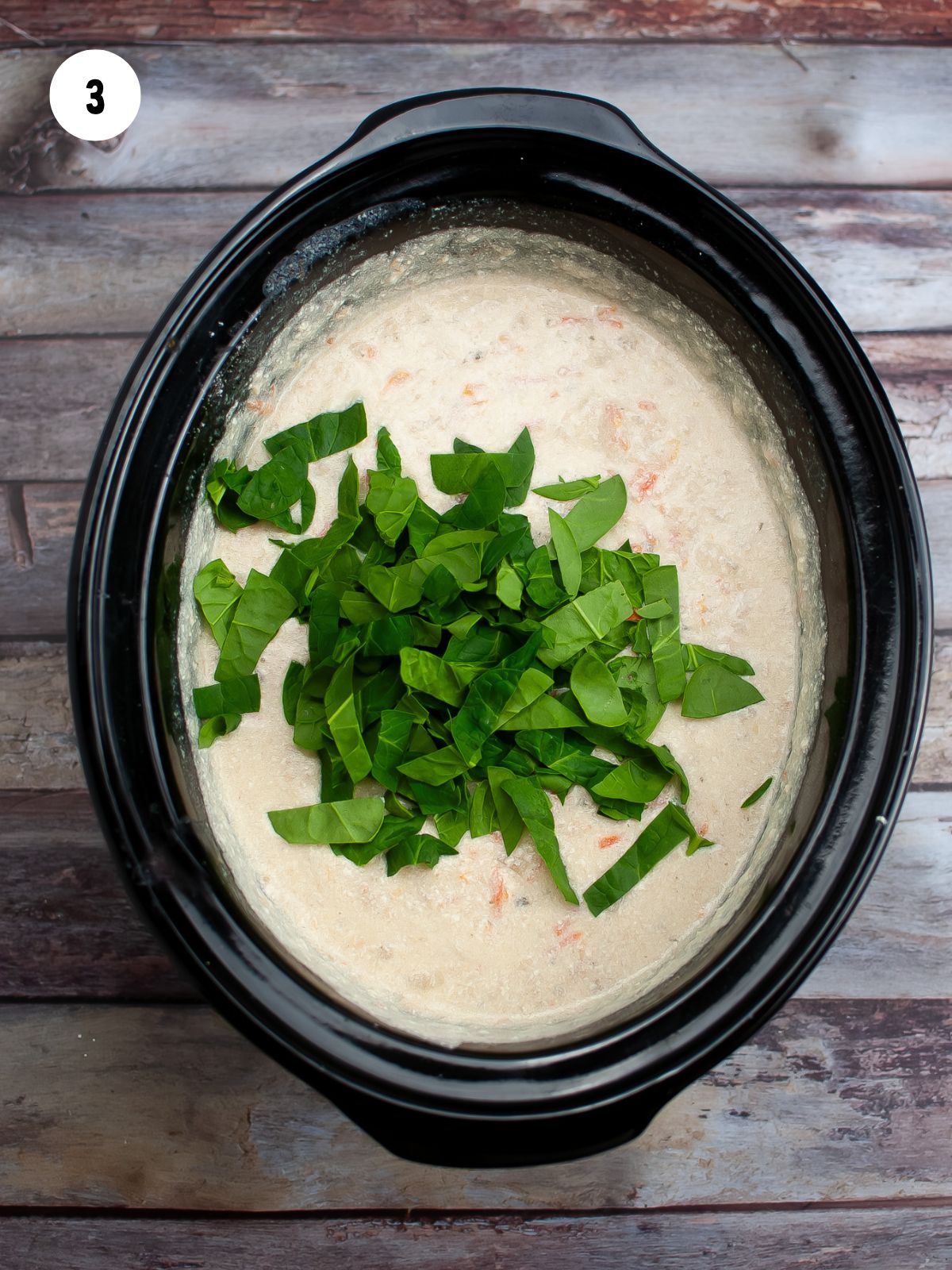 fresh spinach added to the soup