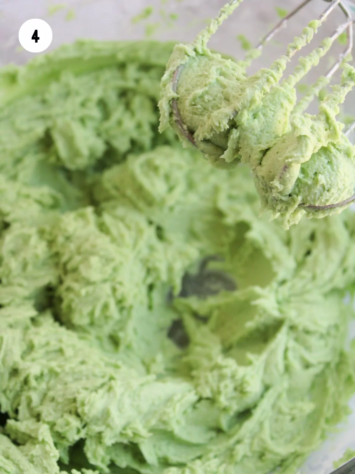 green frosting in a mixing bowl