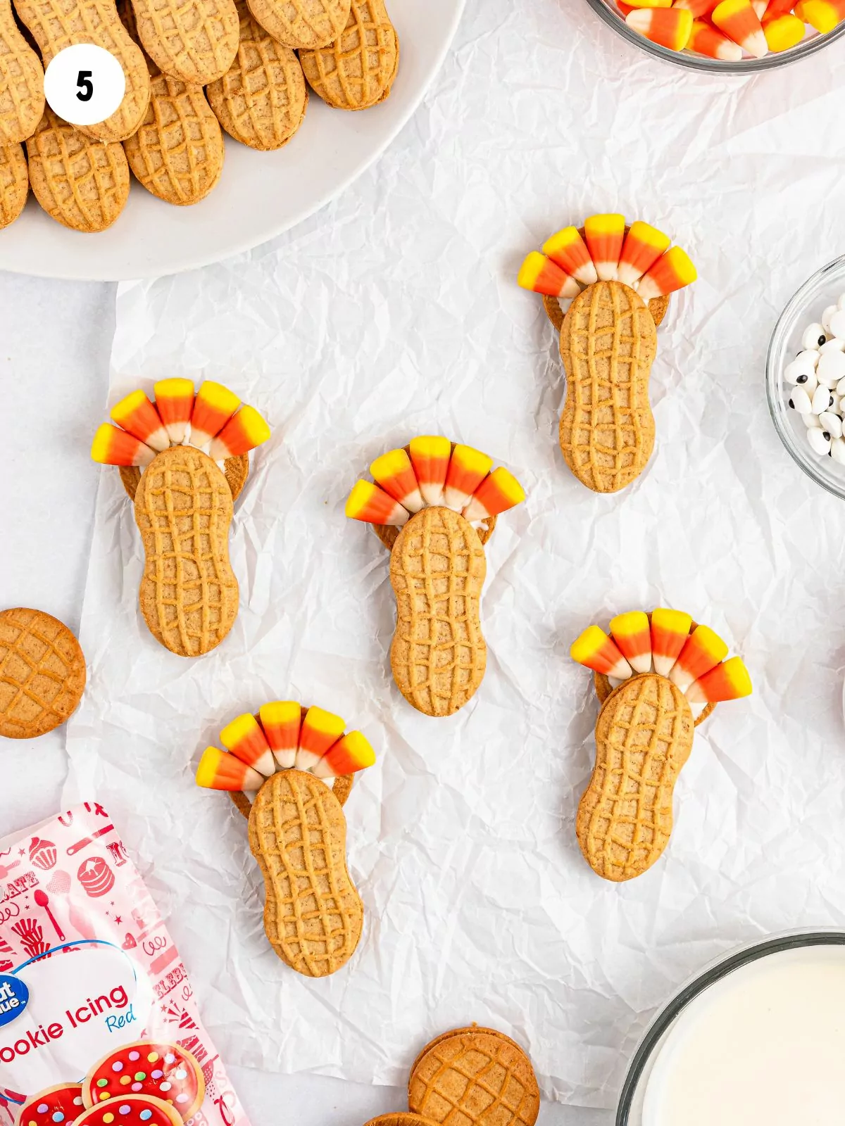 candy corn added on the top half of the round cookie