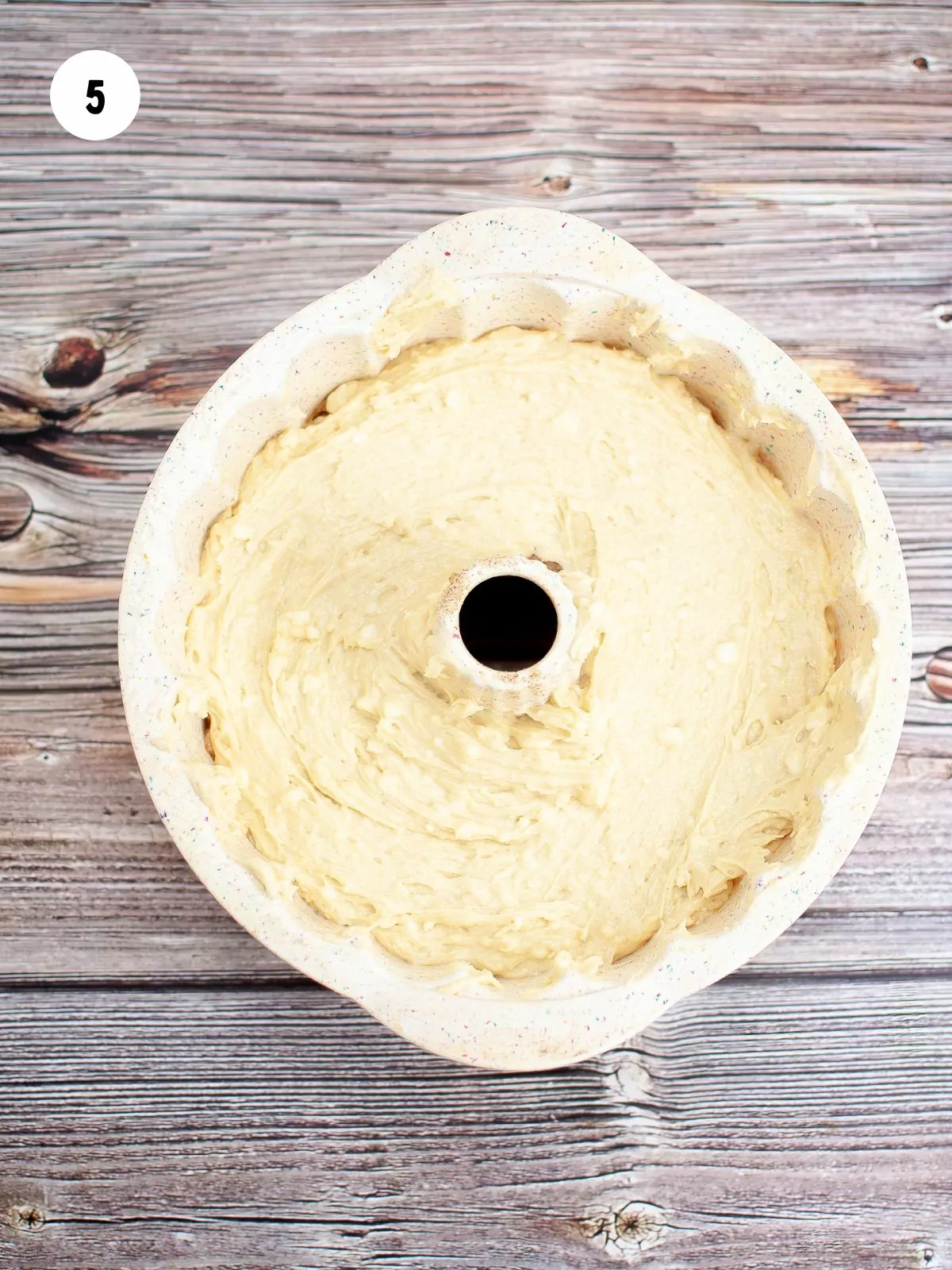 more batter added on top of the cinnamon sugar to fill the bundt pan