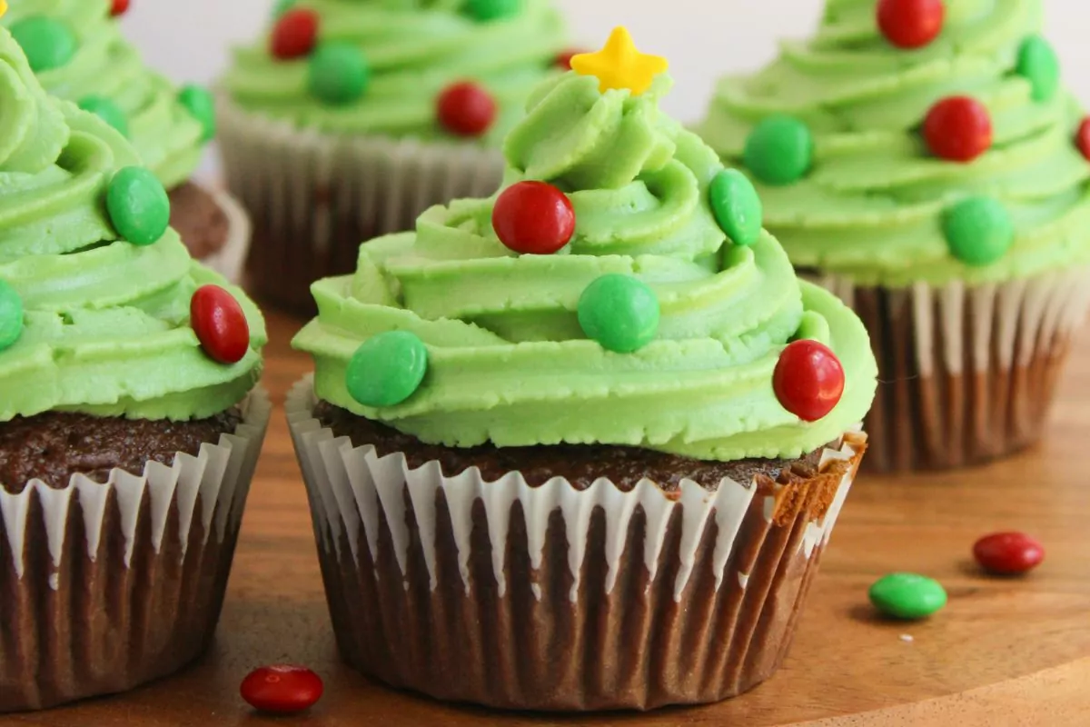 Chocolate Christmas Cupcakes with red and green mini m&m's and a yellow star sprinkle on top