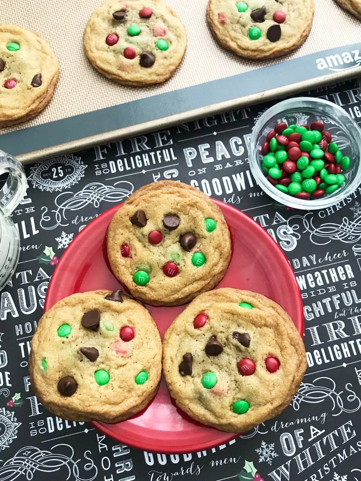 red plate with chocolate chip cookies and M&Ms.