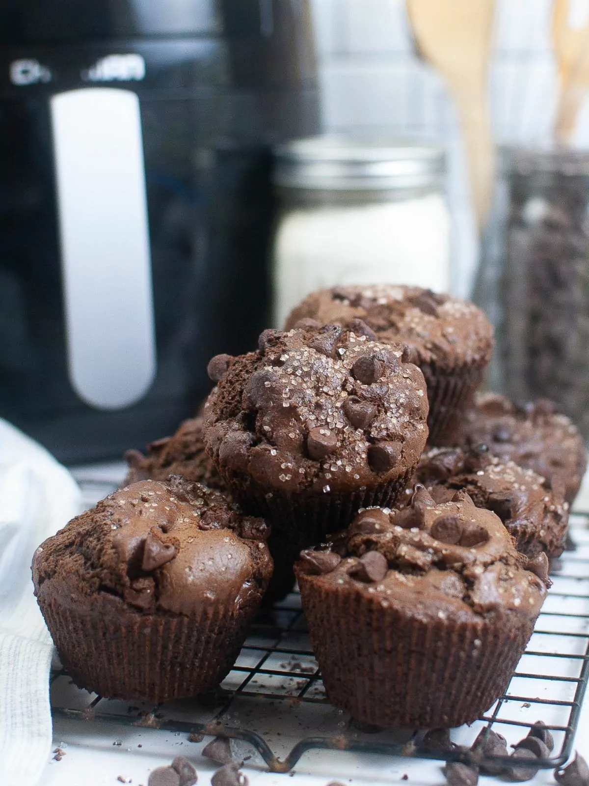 Air Fryer Chocolate Muffins with an air fryer in the background