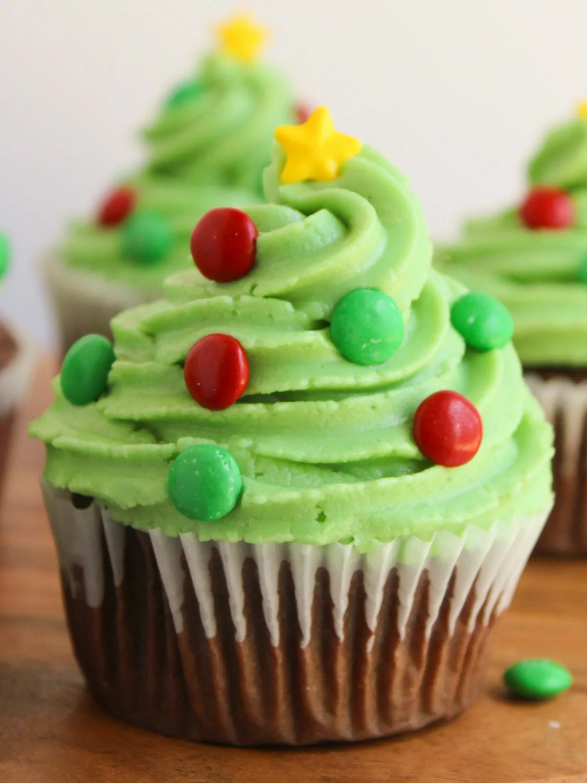 Chocolate Christmas Cupcakes with red and green mini m&m's and a yellow star sprinkle on top