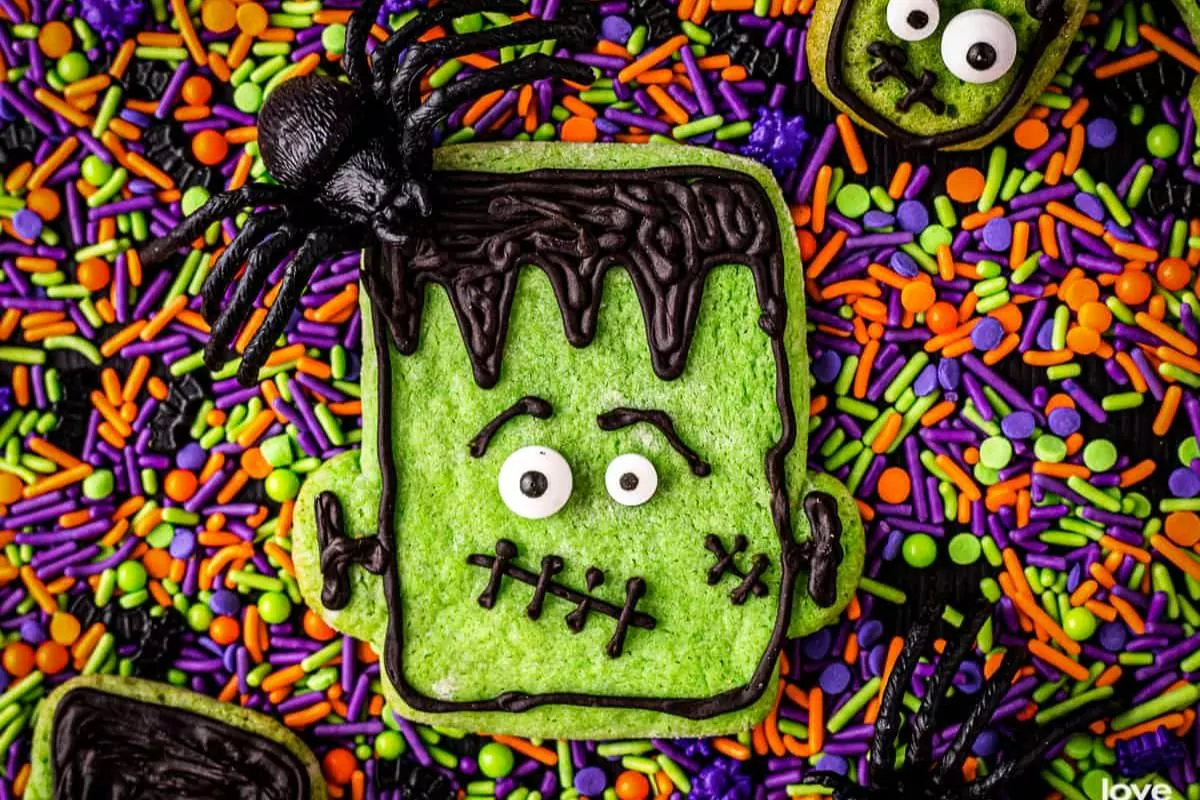 fun Frankenstein cookies on top of colorful sprinkles.