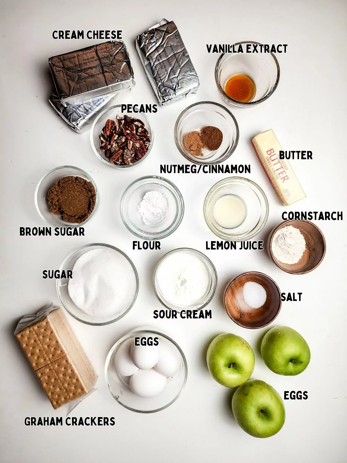 ingredients in small bowls for cheesecake.