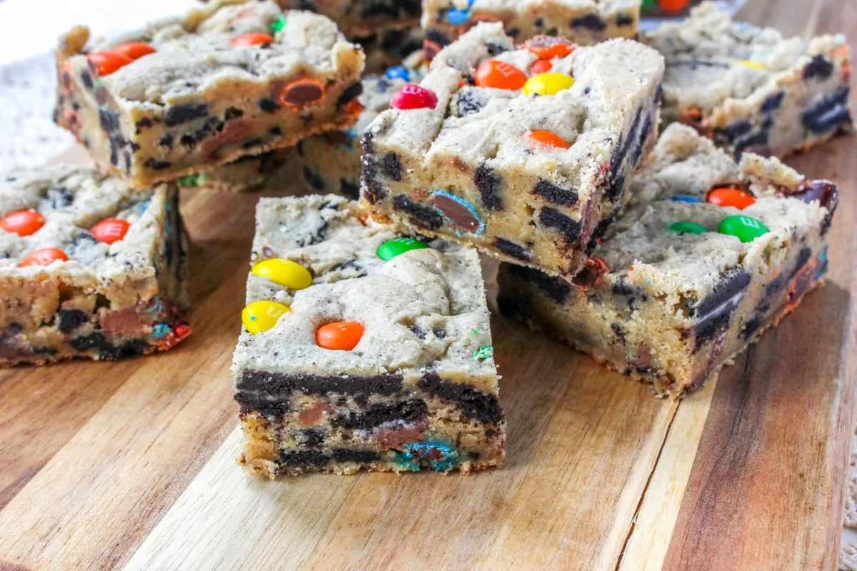 M&M cookie bars on a wood board