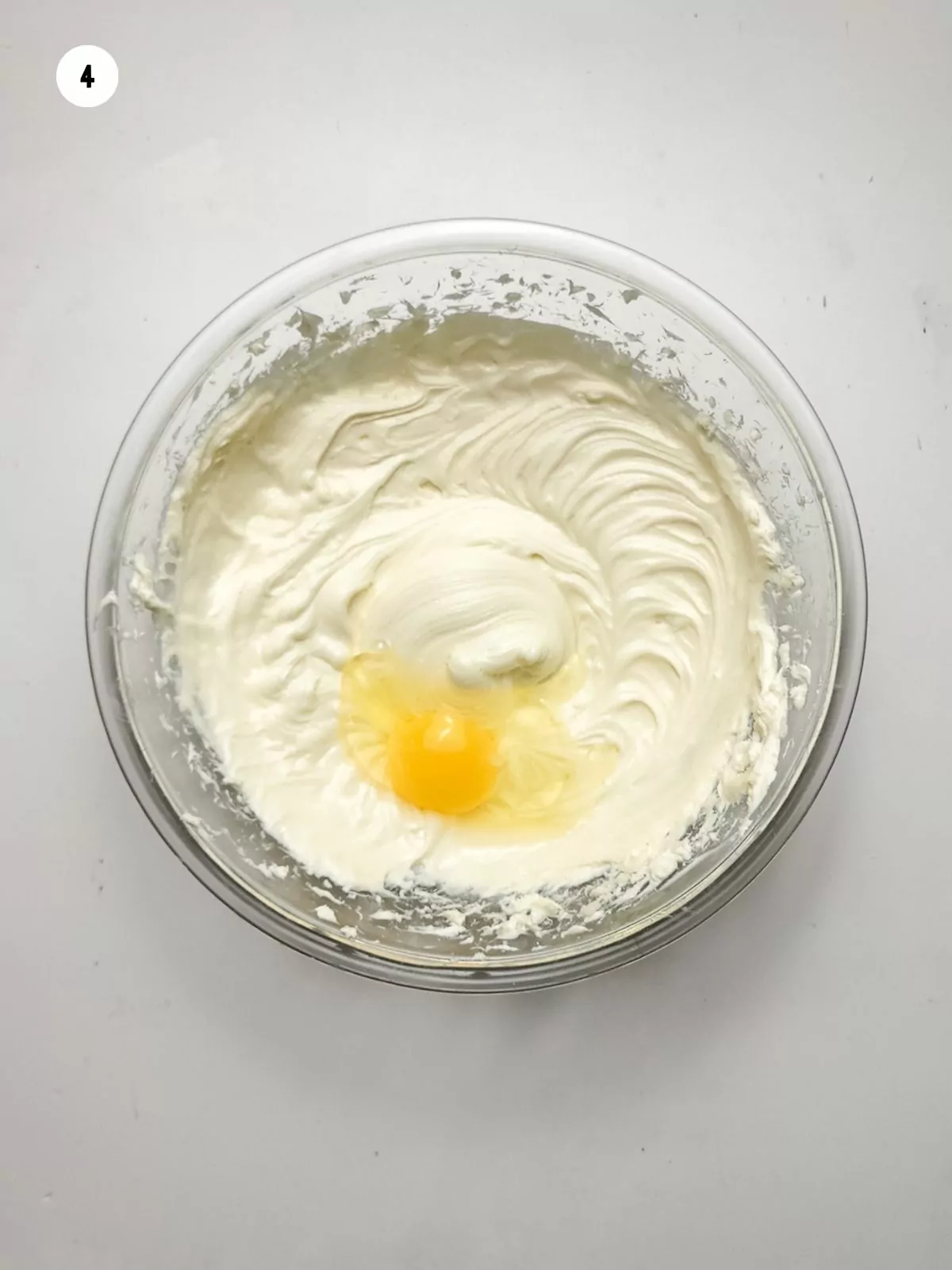 cream cheese mixture with egg in bowl.