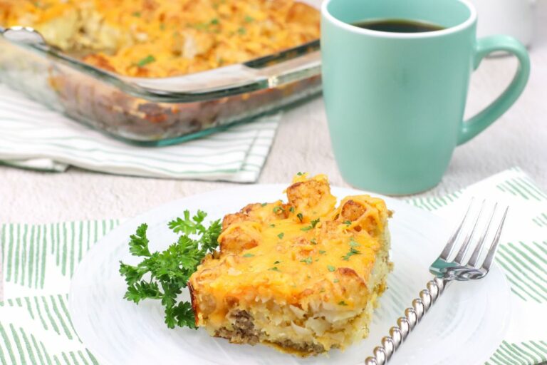 plate of breakfast casserole with sausage and tater tots.