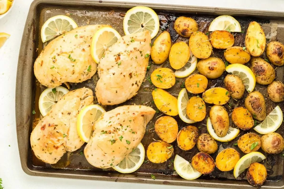 chicken, lemon, potatoes baked on sheet pan.