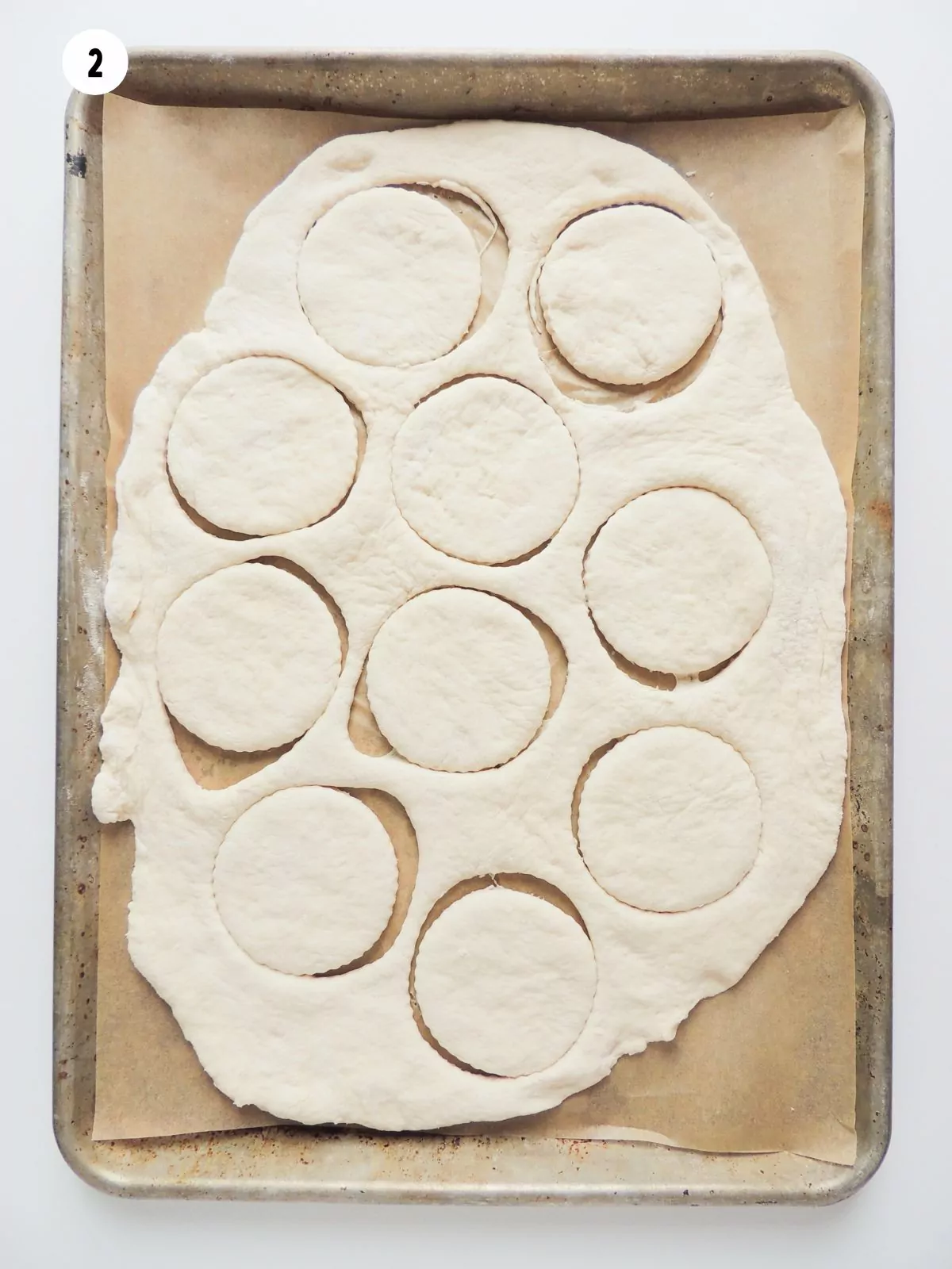 pizza dough circles on baking tray.