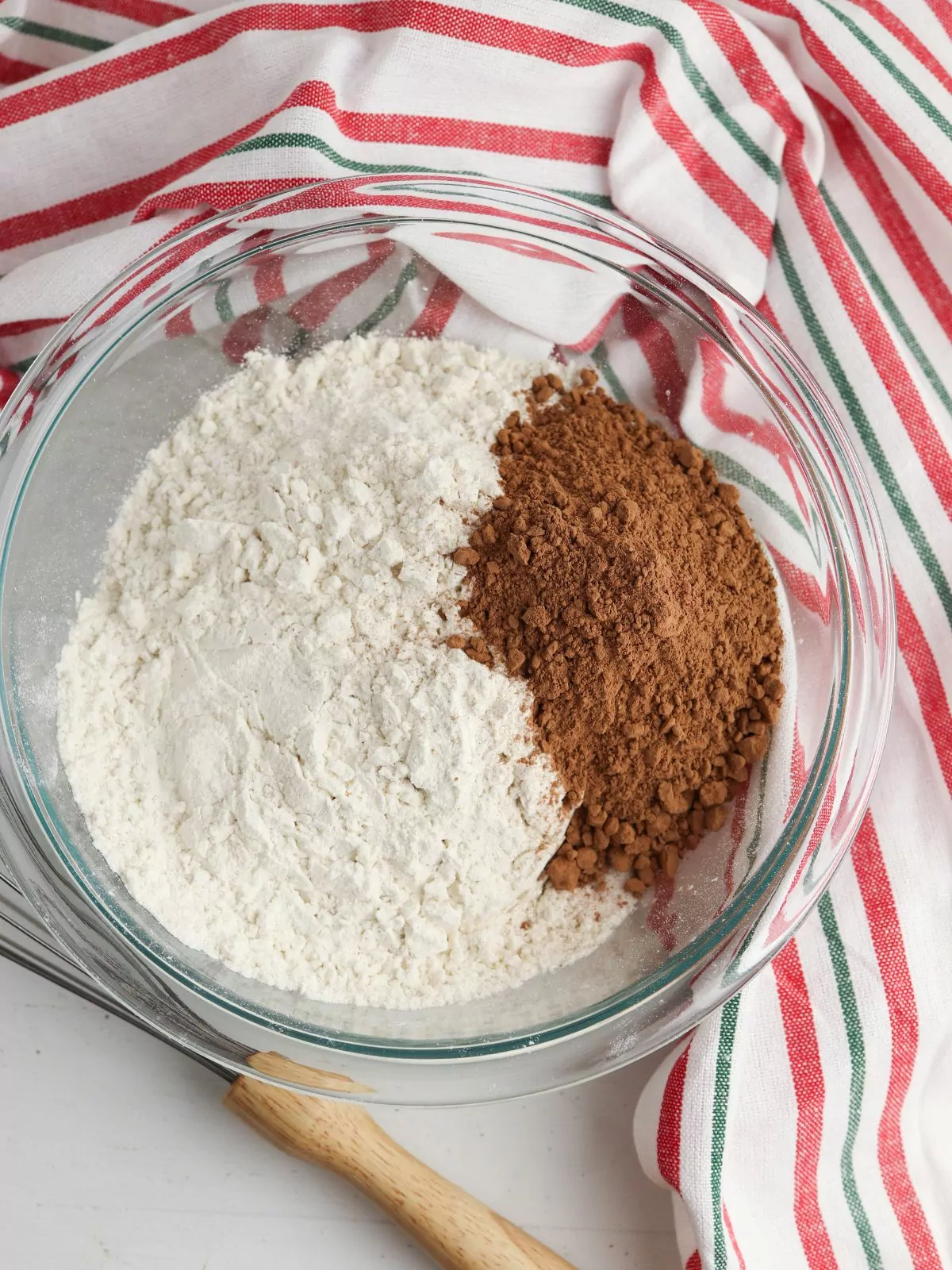 flour, and cocoa powder in clear bowl.