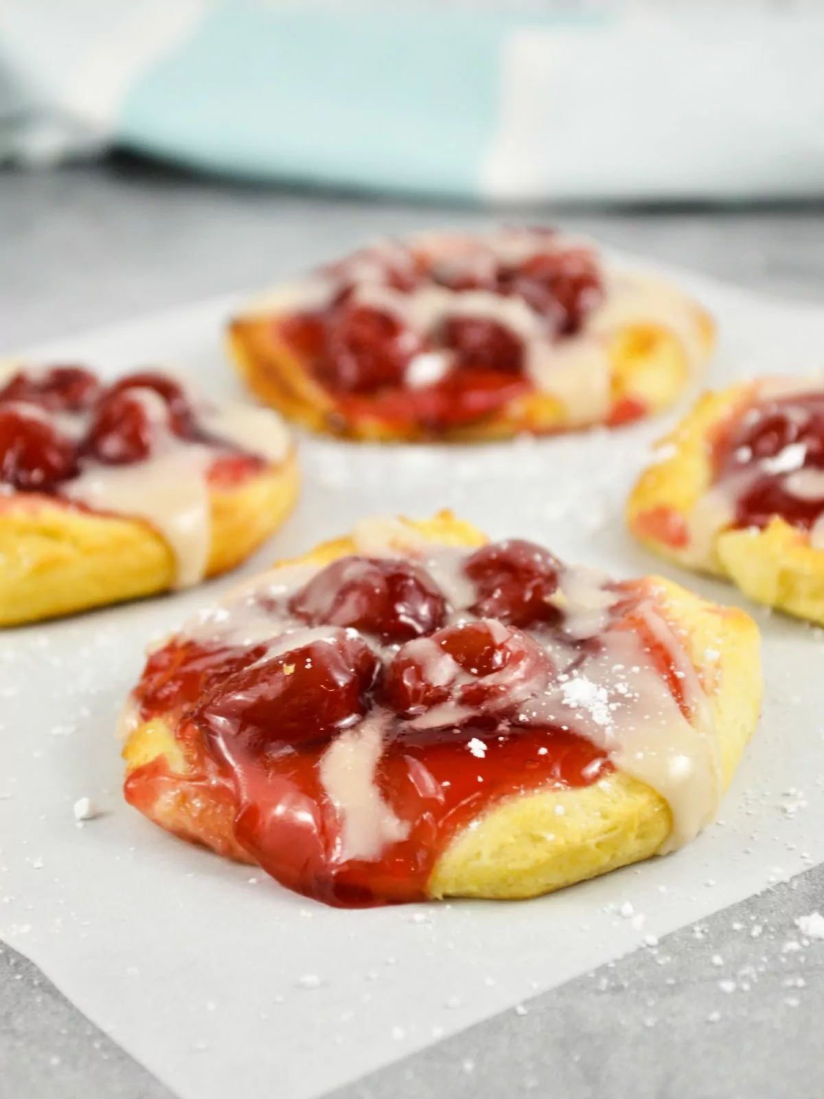 baked cherry biscuits on parchment paper.