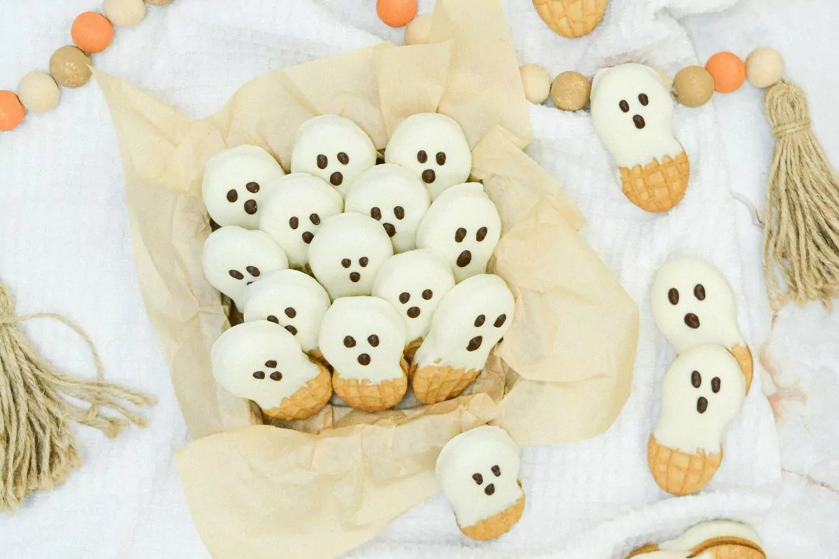 nutter butter cookies decorated as ghosts for Halloween.